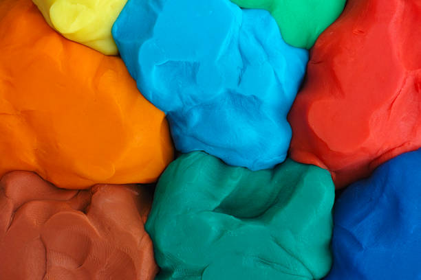 Colorful plasticine texture Colorful plasticine texture. Close up. clay stock pictures, royalty-free photos & images
