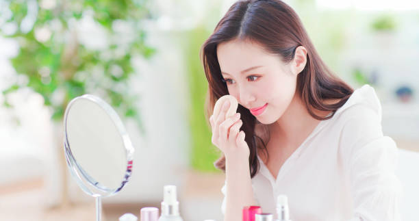 istock asian woman using cosmetic sponge 1129150725