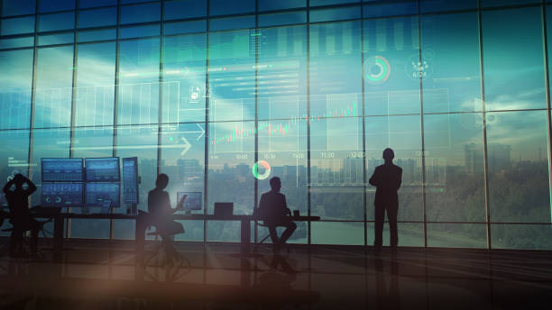 istock A team of traders in front of infographics 1129150894