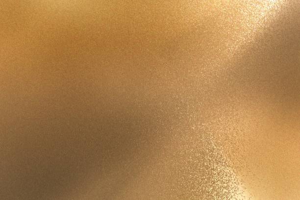 istock Glowing bronze steel wall texture, abstract background 1129150969