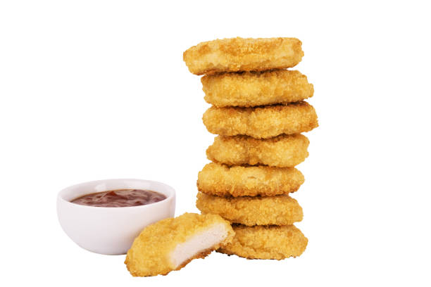 istock Pile of chicken nuggets isolated on a white background. 1129151709