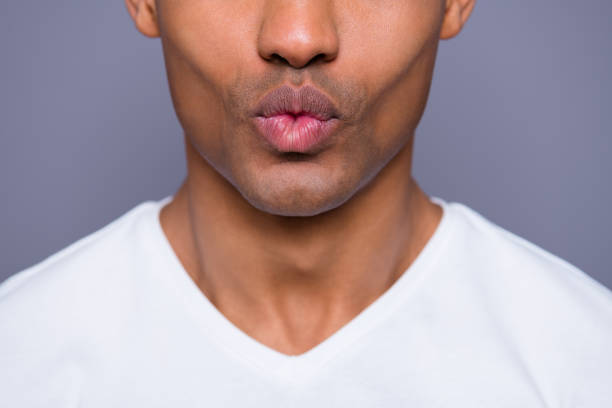 Close-up cropped portrait of his he nice handsome attractive well-groomed cheerful guy wearing white shirt hot kiss isolated over gray violet purple pastel background Close-up cropped portrait of his he nice handsome attractive well-groomed cheerful guy wearing white shirt hot kiss isolated over gray violet purple pastel background blowing a kiss stock pictures, royalty-free photos & images