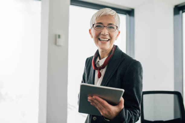 istock Business woman with digital tablet 1129154159