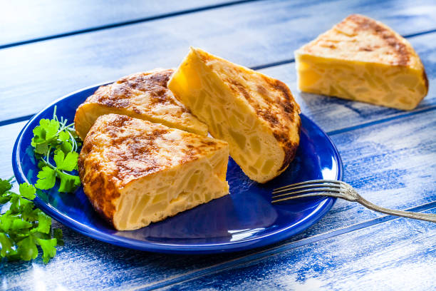 istock Tapas: spanish tortilla slices shot from above on blue table 1129154937