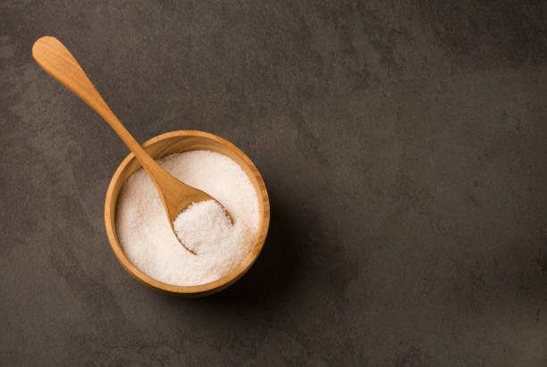 istock Sea salt crystals - Gray background. Top view 1129157869