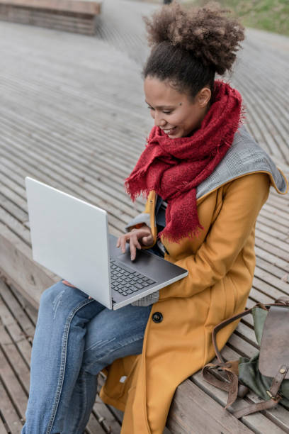 istock Young woman working outdoors in nature 1129158283