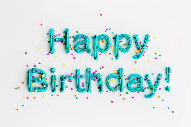 Blue buttercream frosting spelling happy birthday!