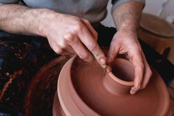 istock Professional potter making bowl in pottery workshop 1129159435