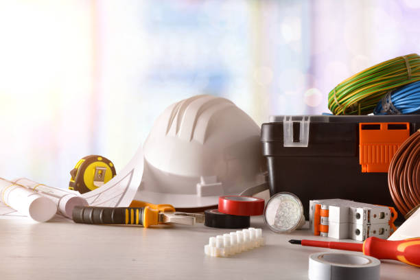 istock Electrician's office table with electrical equipment window background front view 1129160894