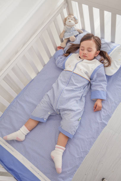 istock cute little girl sleeping in her bed 1129162065