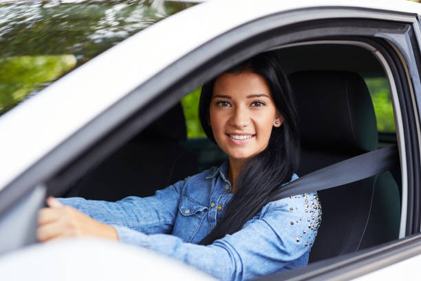 istock Young woman driving her car 1129162287