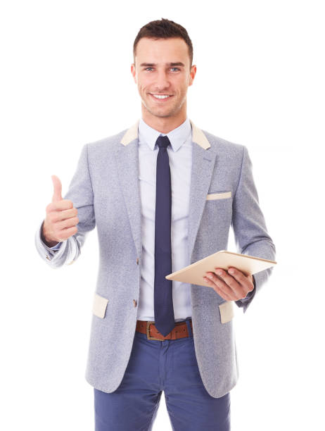 istock Man holding tablet pc and makes a gesture thumb up 1129162343
