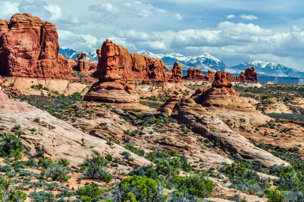 istock Multiple Ridges of Eroded Sandstone and the La Salle Mountains 1129163198