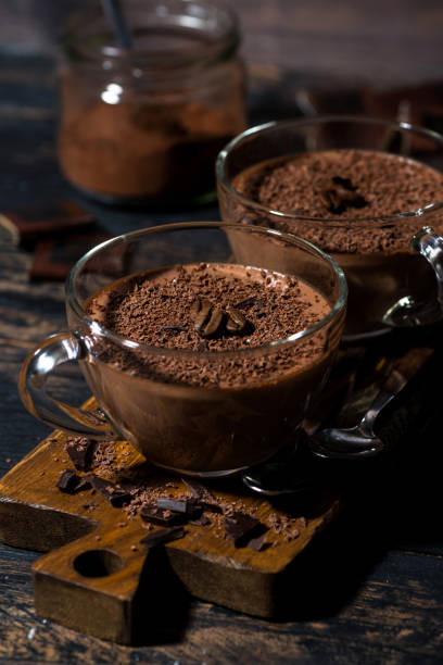 istock chocolate mousse in glass cups, vertical 1129167636