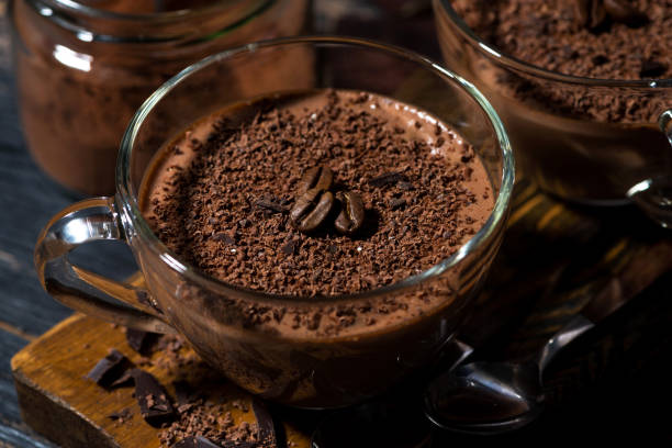 istock sweet chocolate mousse in glass cups 1129168483