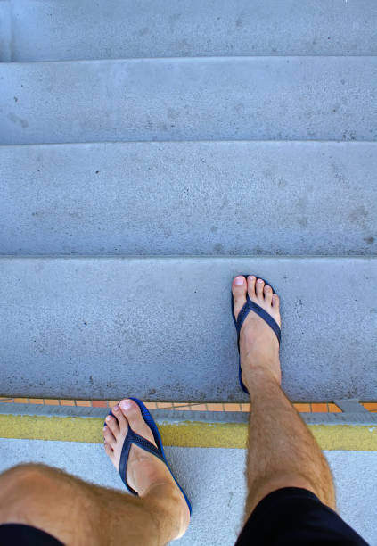 istock POV man coming down the stairs 1129168740