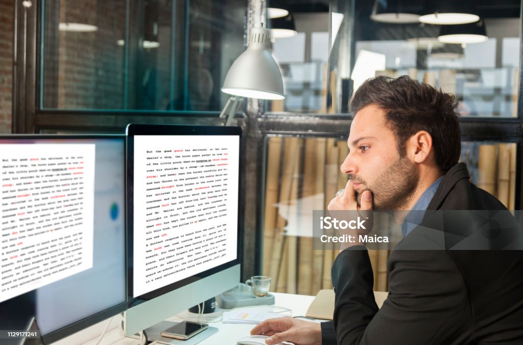 Businessman using computer Translation Stock Photo