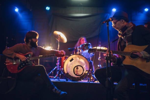 istock Rock band playing at a nightclub 1129171242
