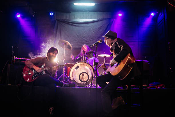 istock Rock band playing at a nightclub 1129171910