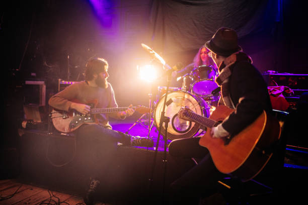 istock Rock band playing at a nightclub 1129172258