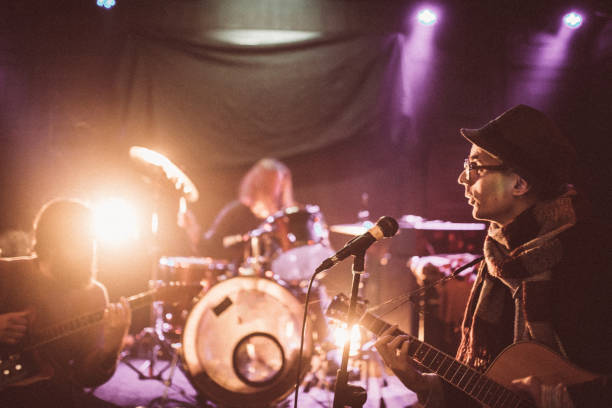 istock Rock band playing at a nightclub 1129172310