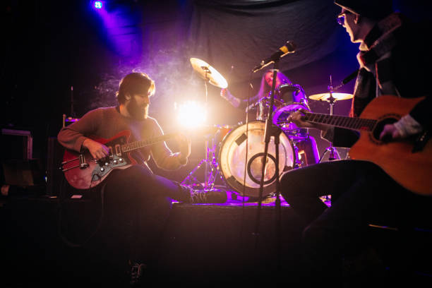 istock Rock band playing at a nightclub 1129173095