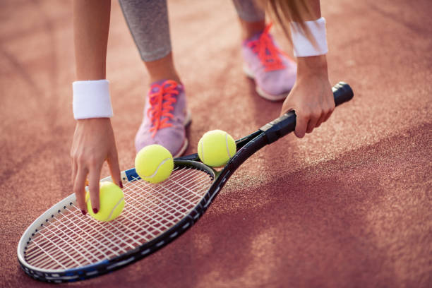 istock Tennis player holding racket and ball in hands 1129173982