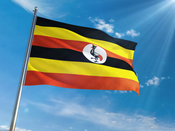 uganda nacional bandera ondeando en polo fondo soleado cielo azul. alta definición - himno nacional turco fotografías e imágenes de stock