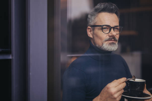 istock Mature man in the coffee shop 1129175582