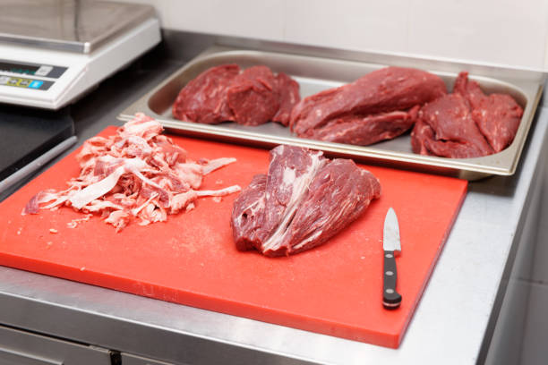 istock Trimming meat in a restaurant 1129176306
