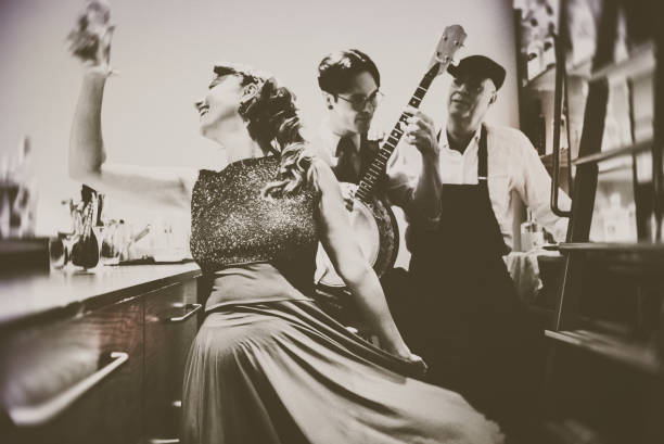 Fun with the banjo player in the bar!!! Banjo, Analog, Music, Art, Close-up, Beauty, vintage, couple, trio, 1940s style stock pictures, royalty-free photos & images