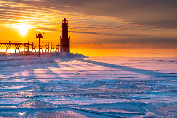 istock Breathtaking Sunrise Casts Long Shadows Across Cold, Icy Harbor 1129179638