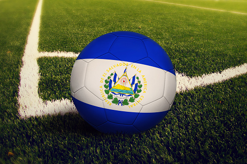 El Salvador ball on corner kick position, soccer field background. National football theme on green grass.