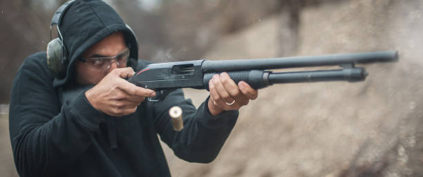 istock Combat shotgun shooting training. Long gun, pump gun and scattergun 1129185030