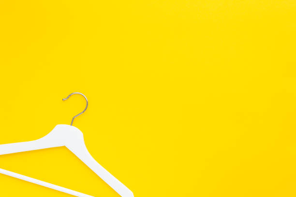 istock White hangers background for sale shopping concept 1129185051