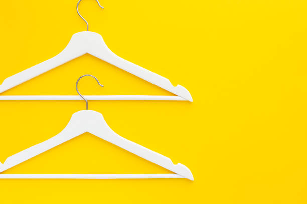 istock White hangers background for sale shopping concept 1129185121