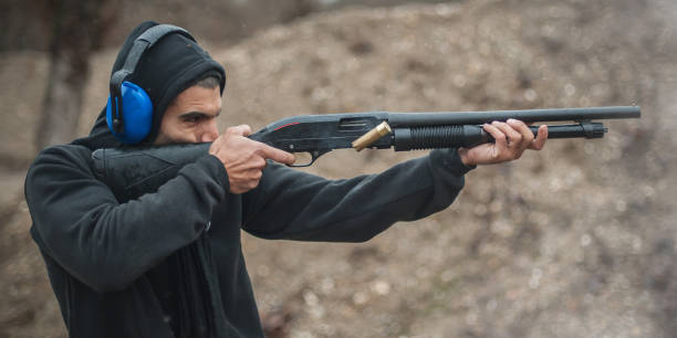 istock Combat shotgun shooting training. Long gun, pump gun and scattergun 1129185437