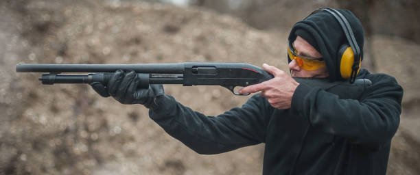 istock Combat shotgun shooting training. Long gun, pump gun and scattergun 1129187665