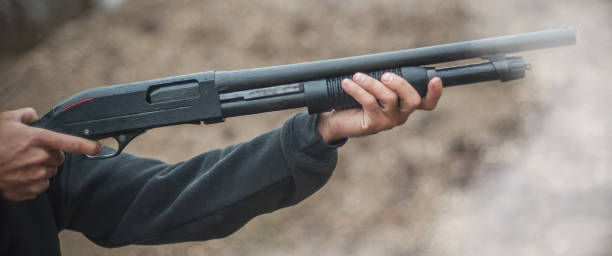 istock Combat shotgun shooting training. Long gun, pump gun and scattergun 1129187849