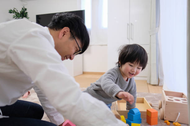 istock Father playing with child in house 1129187916