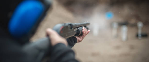 istock Combat shotgun shooting training. Long gun, pump gun and scattergun 1129187977