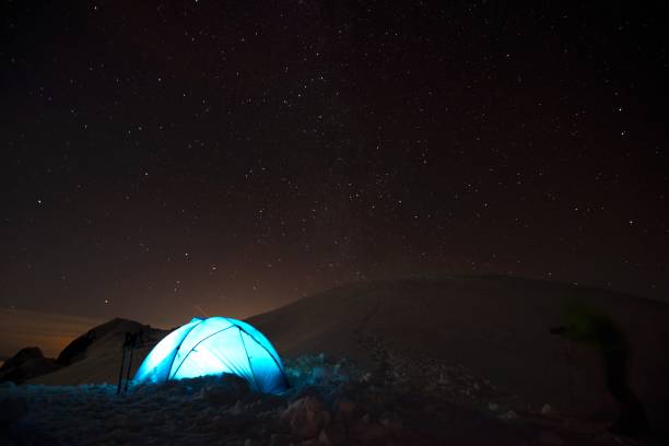 istock Camp site underneath sky full of stars 1129188081