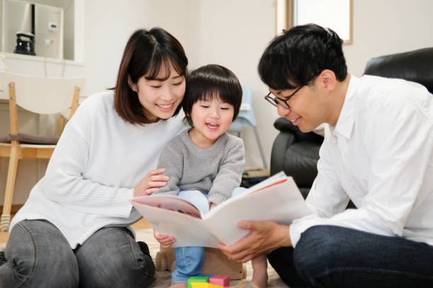 istock Father reading book to child 1129188949
