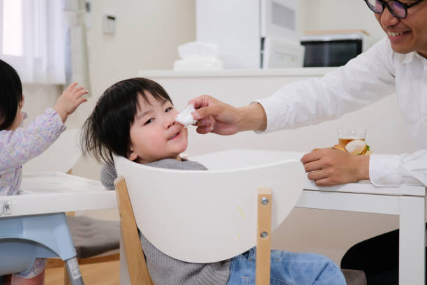 istock Father swiping child's nose 1129189296