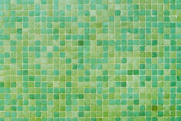 istock Yellow and green mosaic wall background texture 1129189451
