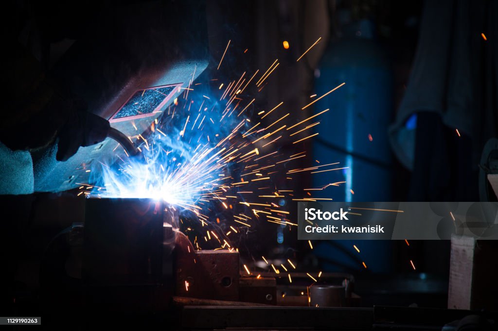 Industrial Welder With Torch Adult Stock Photo