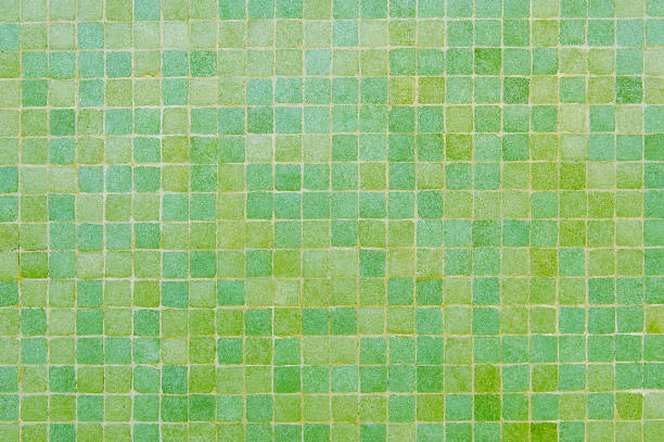 istock Yellow and green mosaic wall background texture 1129190365