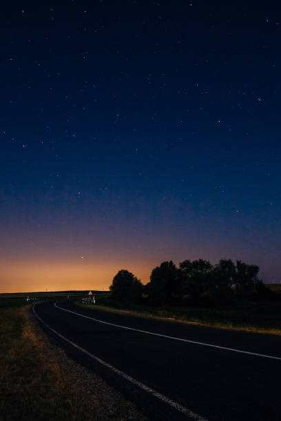 istock Landscape with highway and starry sky 1129192485