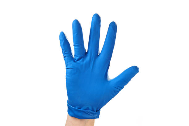 istock Hand in blue rubber glove showing gesture symbol, on white isolate. 1129192663