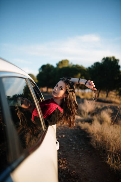 istock Young woman on a road trip 1129193510